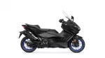Black Yamaha TMAX scooter in a side view, showcasing its sleek body and blue-rimmed wheels