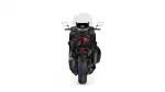 Rear view of a black sport/touring motorcycle with a clear windshield and red taillight against a white background