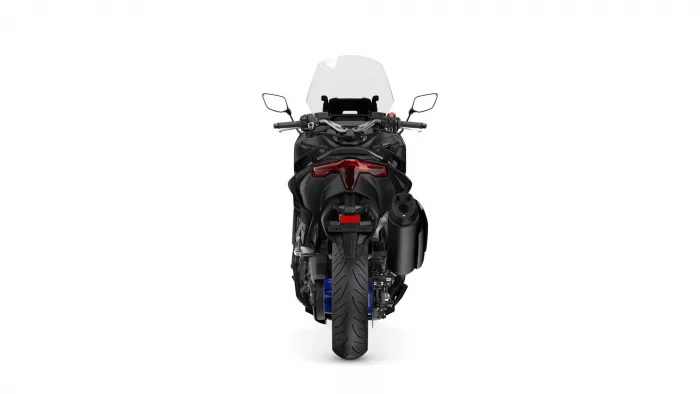 Rear view of a black sport/touring motorcycle with a clear windshield and red taillight against a white background