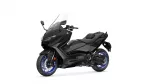 Black Yamaha Tmax sport touring motorcycle with clear windshield, shown from front-left side (blue rims)