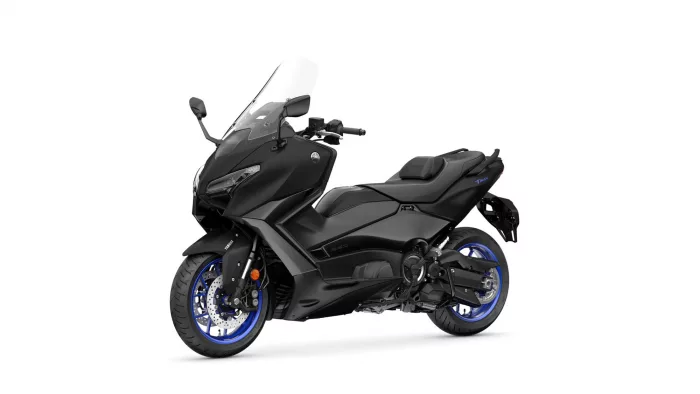 Black Yamaha Tmax sport touring motorcycle with clear windshield, shown from front-left side (blue rims)