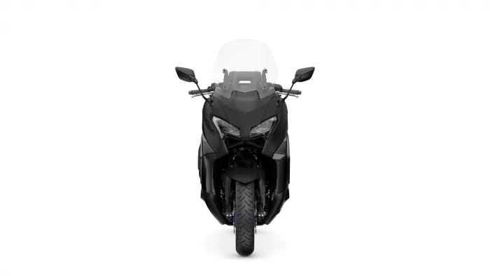 Front view of a black sport motorcycle with a tall windshield and mirrors