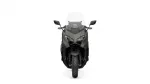 Front view of a gray adventure motorcycle with a tall clear windscreen and angular dual headlights