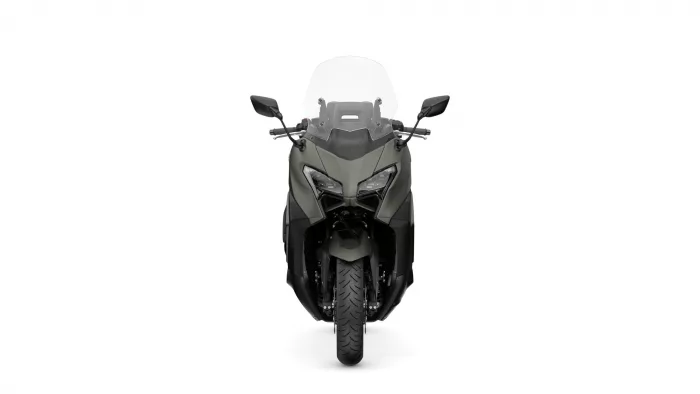 Front view of a gray adventure motorcycle with a tall clear windscreen and angular dual headlights