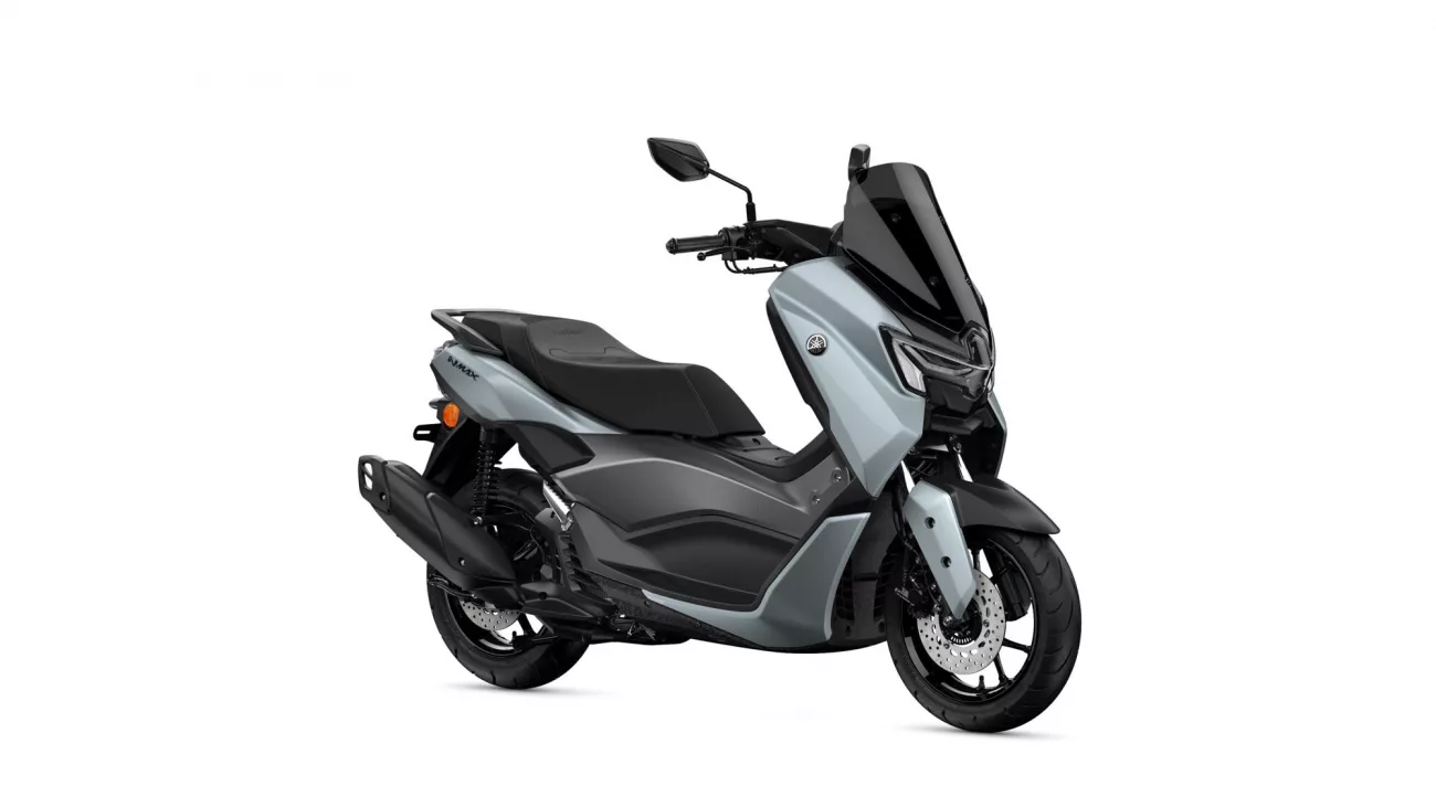Yamaha NMAX scooter in silver-gray with a tall black windshield, shown from the front-right sideology.