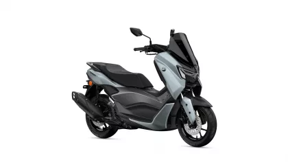 Yamaha NMAX scooter in silver-gray with a tall black windshield, shown from the front-right sideology.