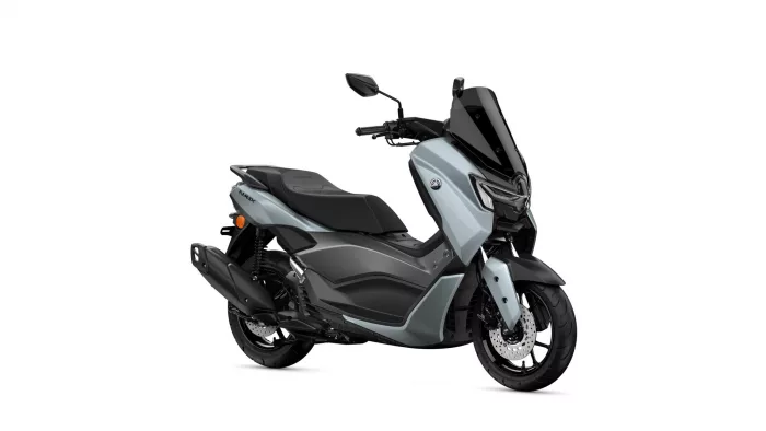 Yamaha NMAX scooter in silver-gray with a tall black windshield, shown from the front-right sideology.