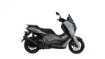 Side view of a gray Yamaha NMAX scooter, showing its front fairing, windscreen, and seat.