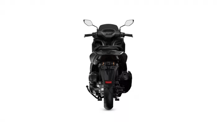Rear view of a black sport motorcycle against a white background, showing taillights, seat, and rear tire.