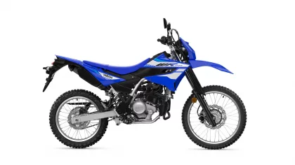 Blue Yamaha dirt bike shown from the side with knobby tires on a white background, highlighting its blue bodywork and graphics.