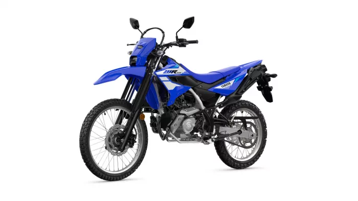 Blue Yamaha dirt/enduro motorcycle shown in a three-quarter front-right view with knobby tires and white graphics on a white background in a studio shot.