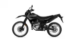 Side view of a black Yamaha dirt bike with knobby tires and exposed engine details.