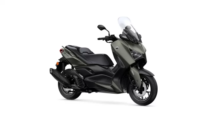 Side view of a matte olive-green Yamaha scooter with large windscreen and black seat