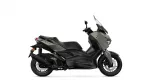 Side view of a matte gray Yamaha XMAX sport scooter with a tall windshield and black accents