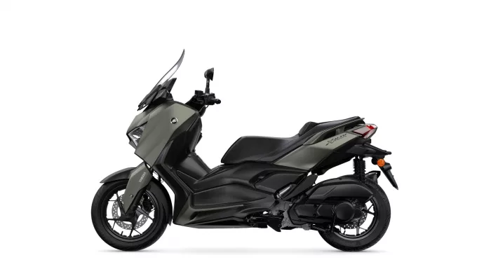 Side view of a gray Yamaha XMAX scooter with windshield and dual front discs
