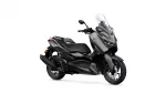 Gray and black Yamaha scooter with a tall clear windshield and contoured seat, angled to show the front and side profile