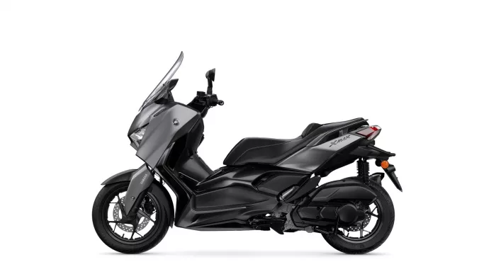 Side view of a gray and black Yamaha XMAX scooter with a windshield, shown from the left.