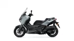 Side view of a gray Yamaha X-MAX scooter with black seat and wheels, showcasing its front fairing and windshield