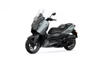 Grey and black Yamaha XMAX scooter shown from a front-side angle with a tall windshield and cargo-friendly bodywork, set against a white background.