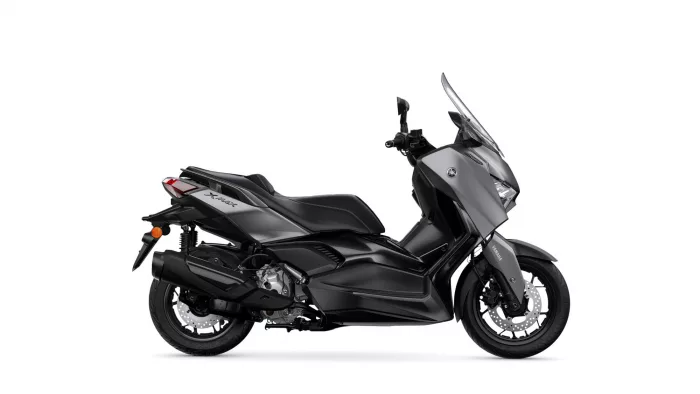 Side view of a black Yamaha XMAX scooter with a tall windshield.