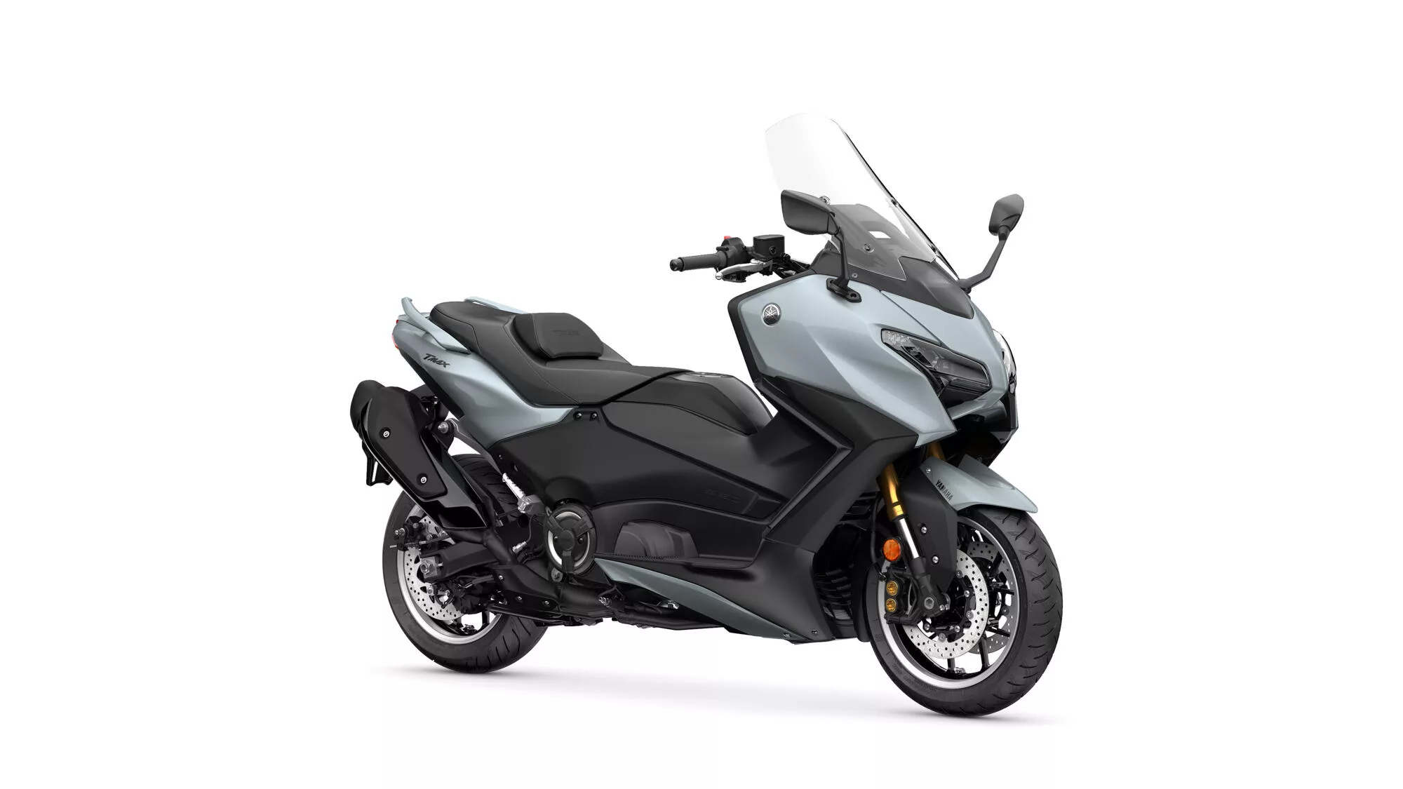 Gray and black Yamaha TMAX sport scooter photographed from a front-right angle with windshield and large front fairing visible