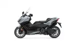 Side view of a gray Yamaha Tracer sport-touring motorcycle with a windshield and black accents.”