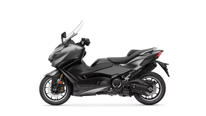 Side view of a gray Yamaha TMAX sport scooter with windshield and exposed engine.