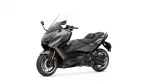 Front-left view of a sleek gray sport motorcycle with a tall windshield against a white background, showcasing its aggressive styling.