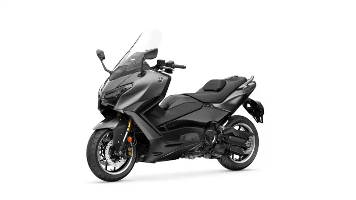 Front-left view of a sleek gray sport motorcycle with a tall windshield against a white background, showcasing its aggressive styling.