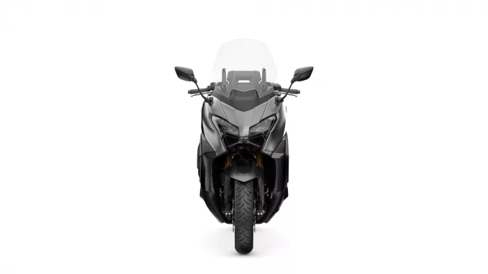 Front view of a gray sport motorcycle with a tall windshield, headlights, and rearview mirrors against a white background.