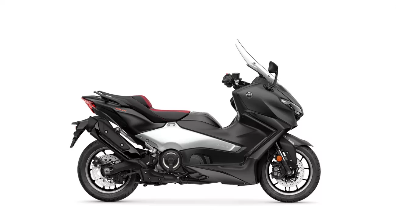 Black Yamaha sport motorcycle shown in a side profile with a red-accented seat and tall windscreen on a white background.