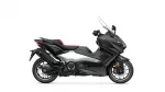 Black Yamaha sport motorcycle shown in a side profile with a red-accented seat and tall windscreen on a white background.
