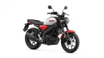 Front-right view of a Yamaha motorcycle with a gray fuel tank, red accents, and black frame and exhaust components.