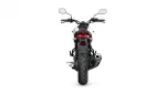 Rear view of a black and red motorcycle showing taillight, turn signals, exhaust on the right, and wide rear tire.