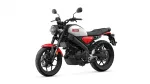 Red Yamaha motorcycle shown from a left-front side angle, with a round headlight and white fuel tank accented by red panels