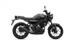 Side view of a matte black Yamaha motorcycle showing the seat, fuel tank, engine, and wheels.