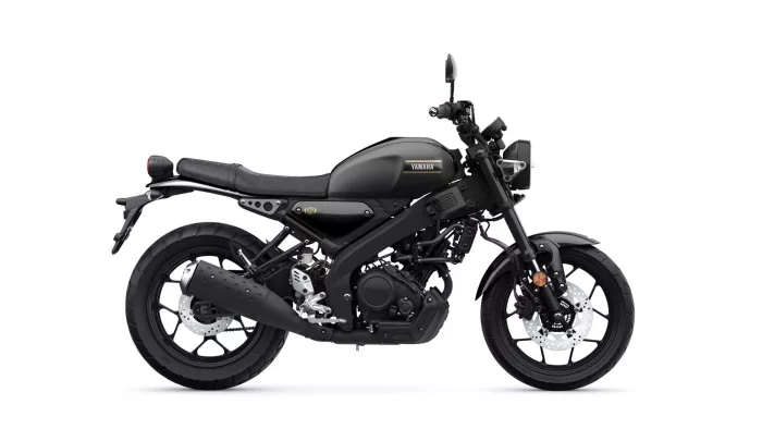 Side view of a matte black Yamaha motorcycle showing the seat, fuel tank, engine, and wheels.