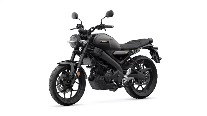 Black Yamaha motorcycle shown from a front-left side view, featuring a round headlamp and matte black finish.