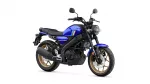 Blue Yamaha motorcycle with gold rims and black frame, shown in a side-front view against a white background.