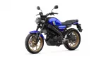 Blue Yamaha motorcycle shown from a front-left angle with a round headlight and gold wheels.