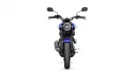 Front view of a blue Yamaha motorcycle facing the camera, round headlight and side mirrors visible.
