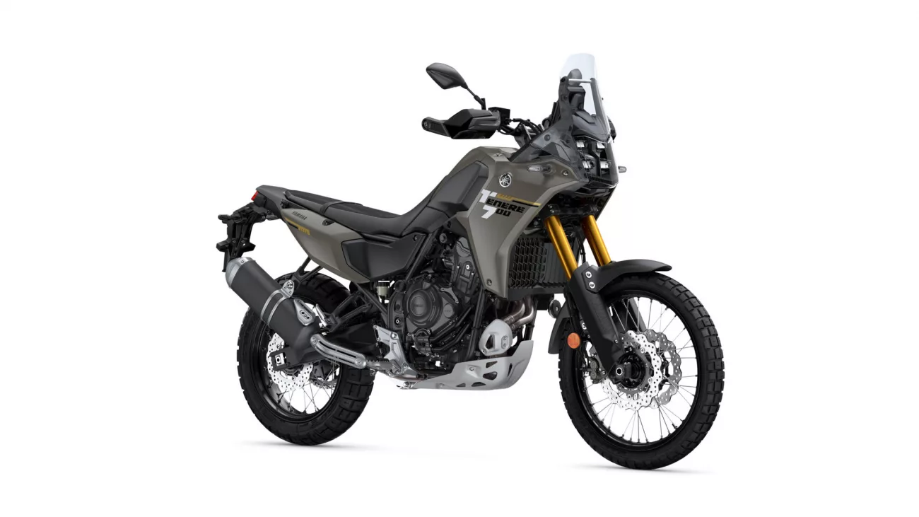 Yamaha Tenere 700 adventure motorcycle shown in side view with gray bodywork and gold front forks.