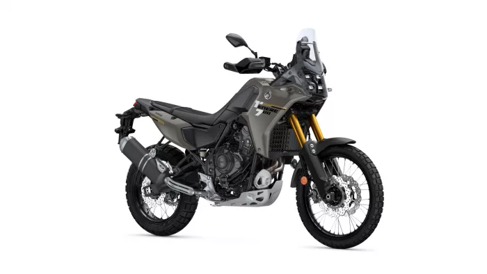 Yamaha Tenere 700 adventure motorcycle shown in side view with gray bodywork and gold front forks.