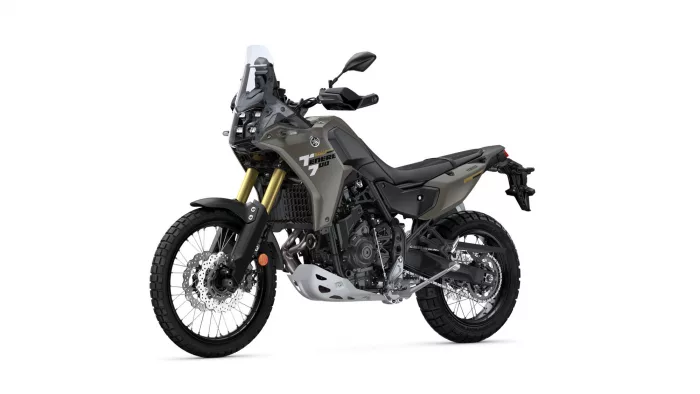 Yamaha Tenere 700 adventure motorcycle shown from a front-left side angle with gray body and gold front forks, on white background.