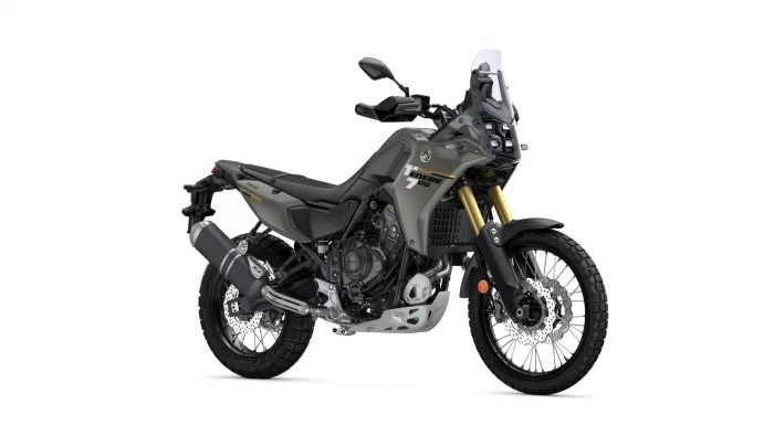 Side view of a Yamaha Tenere 700 adventure motorcycle in olive green with gold front forks and off-road tires