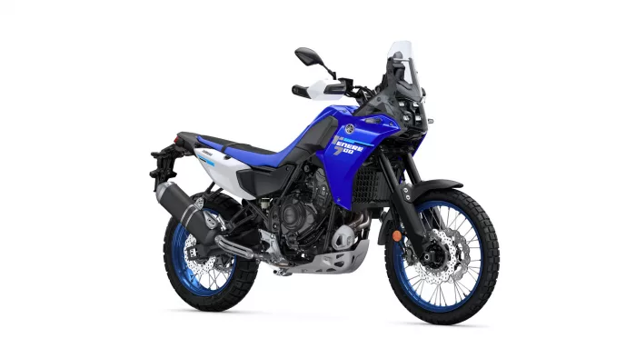 Blue and white Yamaha Tenere 700 adventure motorcycle, shown in a side-front view with windscreen and off-road tires