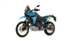 Blue Yamaha Tenere 700 adventure motorcycle with gold wheels and off-road tires on a white background.