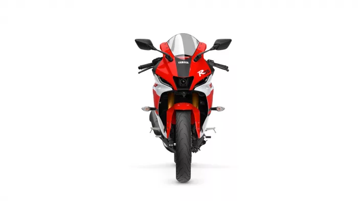 Front view of a red Yamaha sport motorcycle, head-on with black windshield and mirrors prominent.