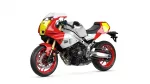 Red, white, and silver Yamaha sport motorcycle (XSR900 GP) with yellow front fairing, exposed frame, and red rims photographed from a side view to showcase its design.