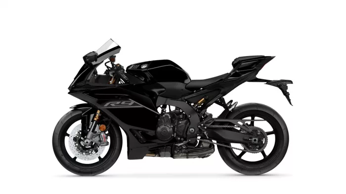 Side view of a sleek black sport motorcycle against a white background, showing disc brakes and exposed engine details